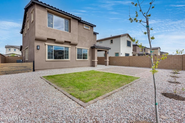 21241 E Superstition Dr, Queen Creek, AZ 85142 - back of property featuring stucco siding, a fenced backyard, and a patio area
