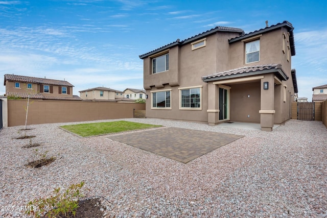 21241 E Superstition Dr, Queen Creek, AZ 85142 - back of house featuring a patio area, stucco siding, a tiled roof, and a fenced backyard
