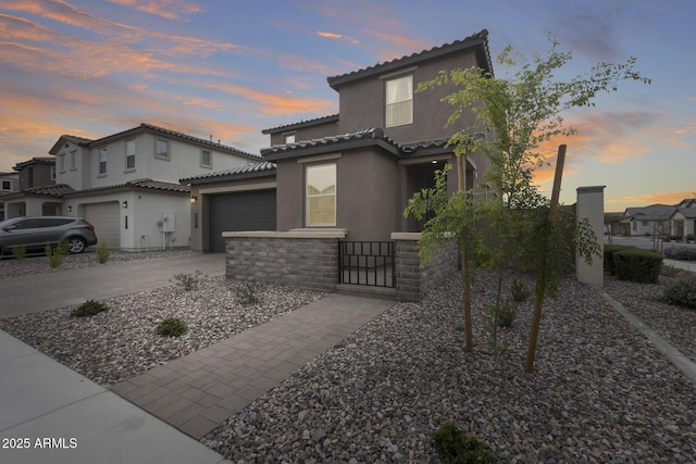 21241 E Superstition Dr, Queen Creek, AZ 85142 - mediterranean / spanish-style home featuring stucco siding, driveway, a tile roof, stone siding, and fence