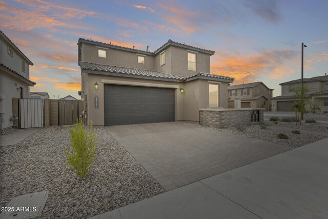 21241 E Superstition Dr, Queen Creek, AZ 85142 - mediterranean / spanish-style house featuring a gate, driveway, stucco siding, a garage, and a tile roof