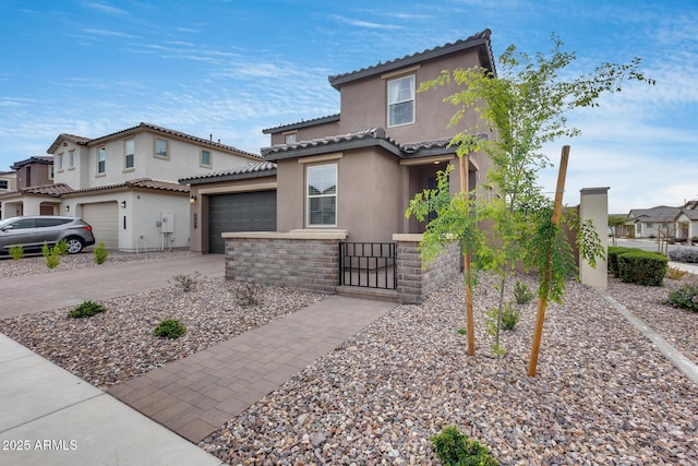 21241 E Superstition Dr, Queen Creek, AZ 85142 - mediterranean / spanish house featuring stucco siding, driveway, stone siding, fence, and a tiled roof