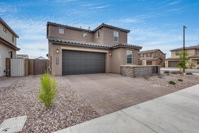 21241 E Superstition Dr, Queen Creek, AZ 85142 - mediterranean / spanish home with stucco siding, decorative driveway, a garage, and a gate