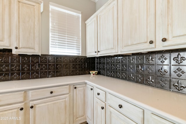 kitchen featuring backsplash and light countertops