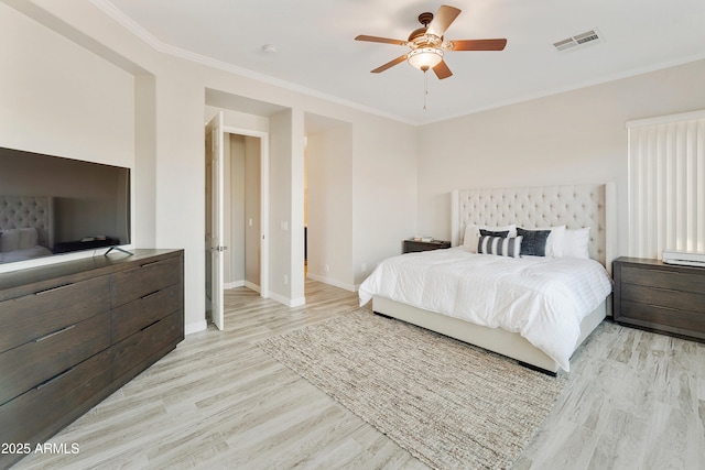 bedroom with a ceiling fan, baseboards, visible vents, light wood-style flooring, and ornamental molding