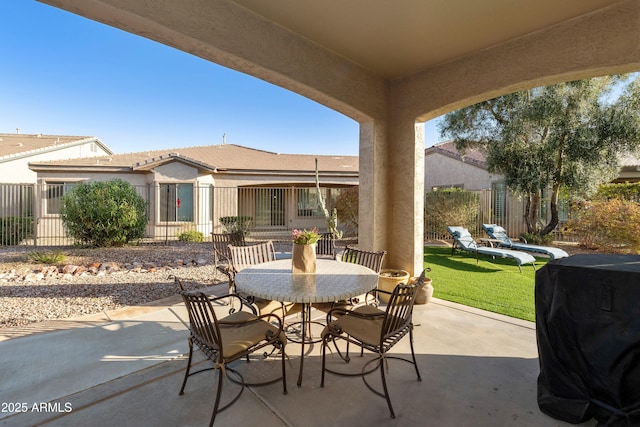 view of patio / terrace featuring outdoor dining space and fence