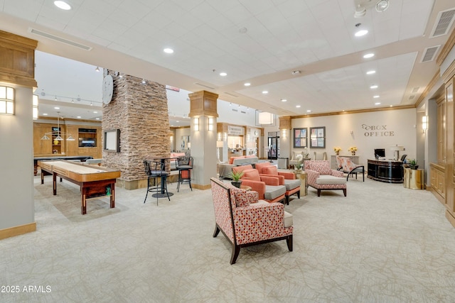 living area featuring recessed lighting, visible vents, light carpet, and ornate columns