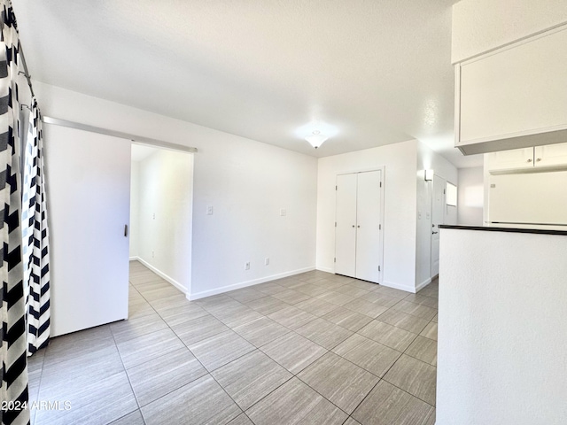 spare room with a textured ceiling