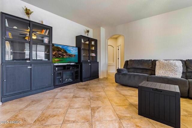 16559 W Lincoln St, Goodyear, AZ 85338 - living area featuring arched walkways and light tile patterned floors