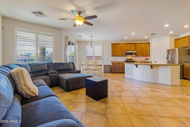 16559 W Lincoln St, Goodyear, AZ 85338 - living room with ceiling fan, recessed lighting, and light tile patterned floors
