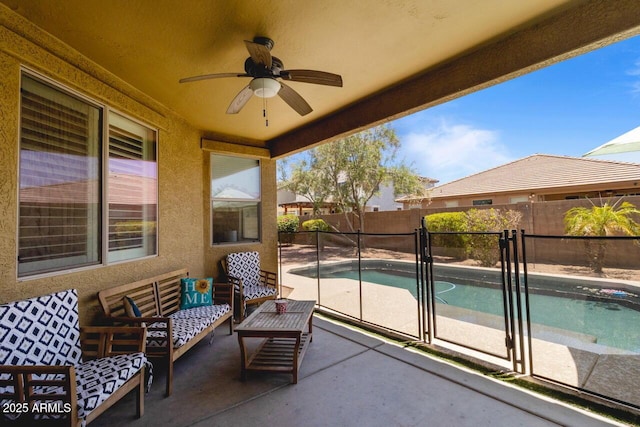 16559 W Lincoln St, Goodyear, AZ 85338 - fenced backyard with a ceiling fan, a patio area, and outdoor lounge area