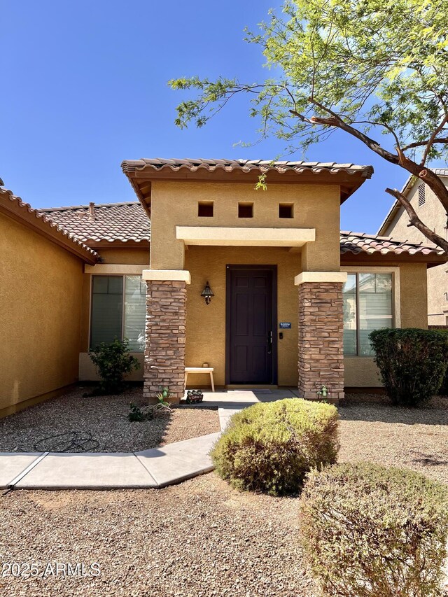 16559 W Lincoln St, Goodyear, AZ 85338 - entrance to property featuring a tiled roof and stucco siding