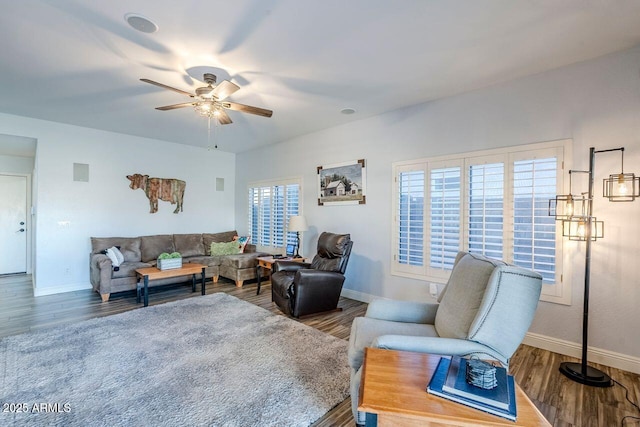 living room featuring hardwood / wood-style flooring and ceiling fan