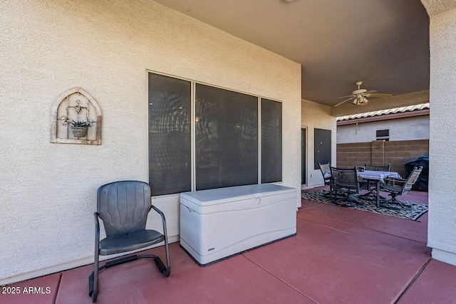 view of patio featuring ceiling fan