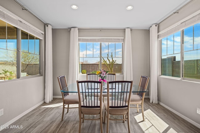 dining area with recessed lighting, wood finished floors, and baseboards