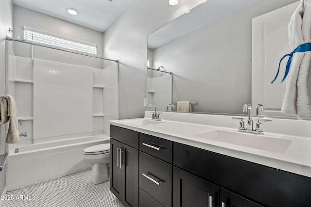 bathroom with tile patterned flooring, toilet, shower / bathing tub combination, and a sink