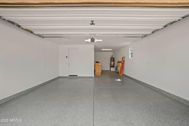 garage featuring gas water heater, a garage door opener, and baseboards