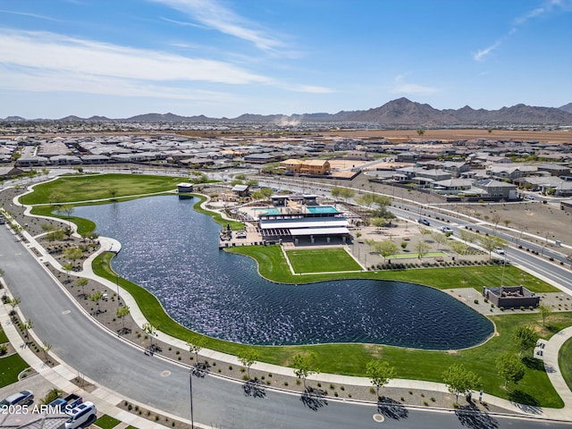 drone / aerial view featuring a residential view and a water and mountain view