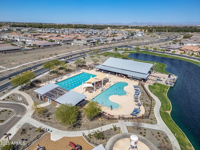 bird's eye view with a residential view and a water view