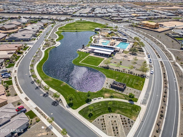 birds eye view of property featuring a water view and a residential view