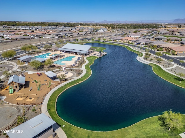 birds eye view of property featuring a residential view and a water view