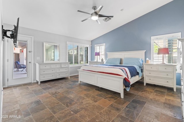 bedroom with ceiling fan, visible vents, baseboards, vaulted ceiling, and stone finish flooring