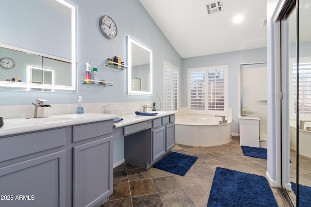 full bathroom featuring a stall shower, visible vents, a garden tub, vaulted ceiling, and vanity