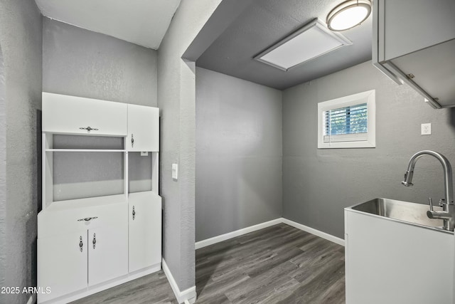 washroom with dark wood-type flooring