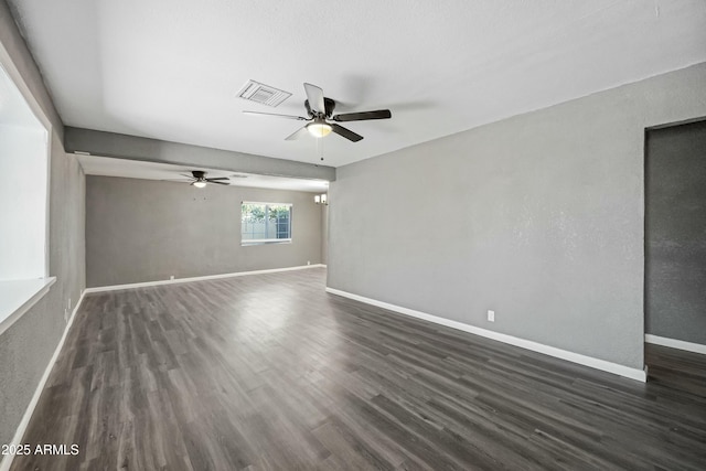 unfurnished room with dark wood-type flooring and ceiling fan