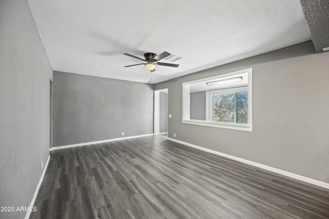 spare room featuring ceiling fan, a textured ceiling, and dark hardwood / wood-style flooring