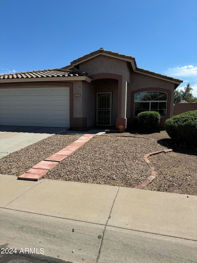 view of front of home with a garage