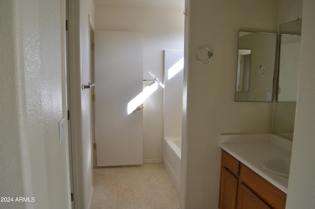 bathroom with vanity and shower / tub combination