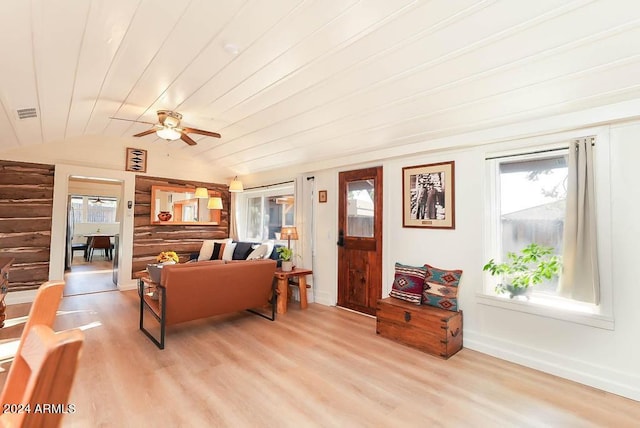 living room with lofted ceiling, ceiling fan, and light hardwood / wood-style floors