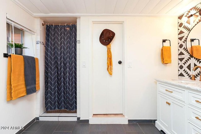 interior space featuring vanity and a shower with curtain