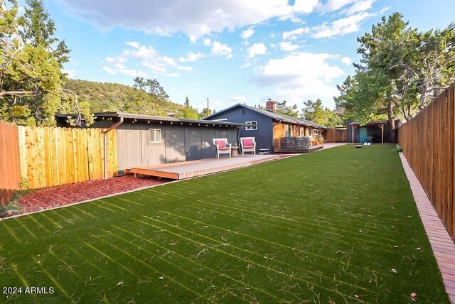 view of yard featuring a deck