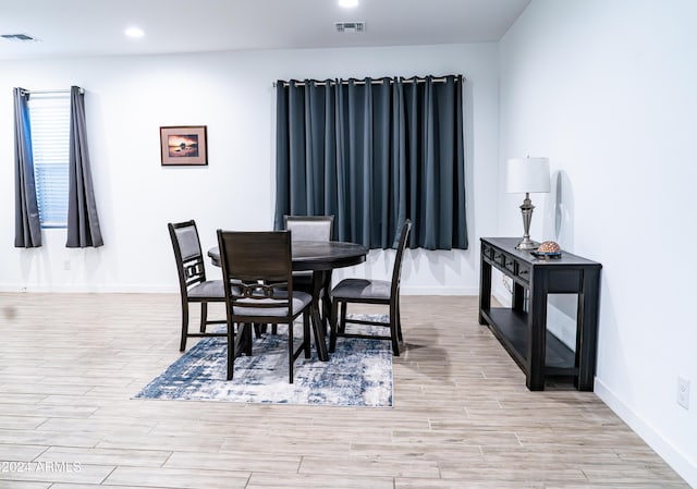 dining room with light hardwood / wood-style floors