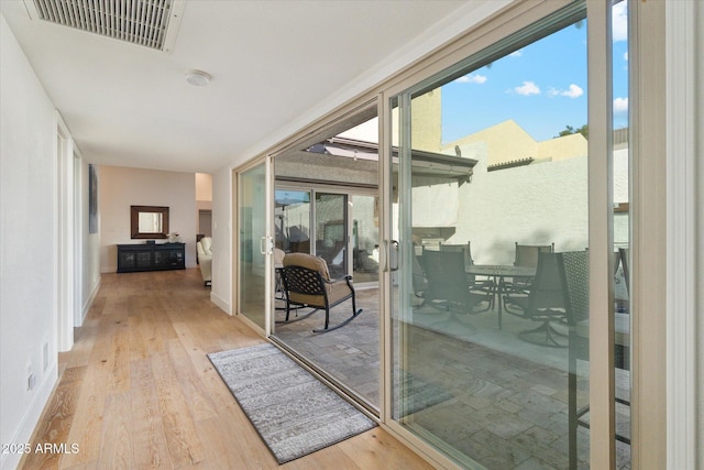 doorway featuring light hardwood / wood-style flooring