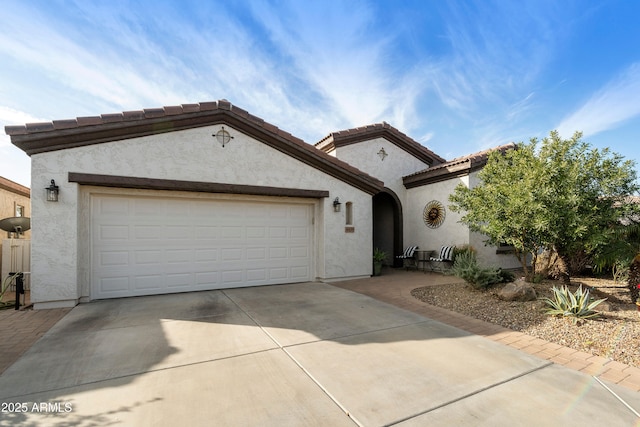 mediterranean / spanish-style house featuring a garage