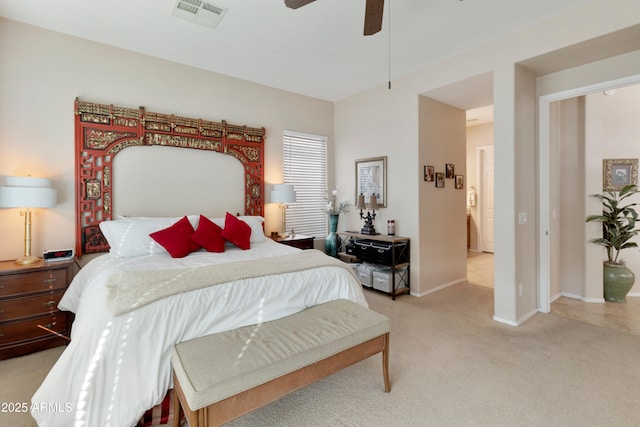 bedroom featuring light colored carpet and ceiling fan