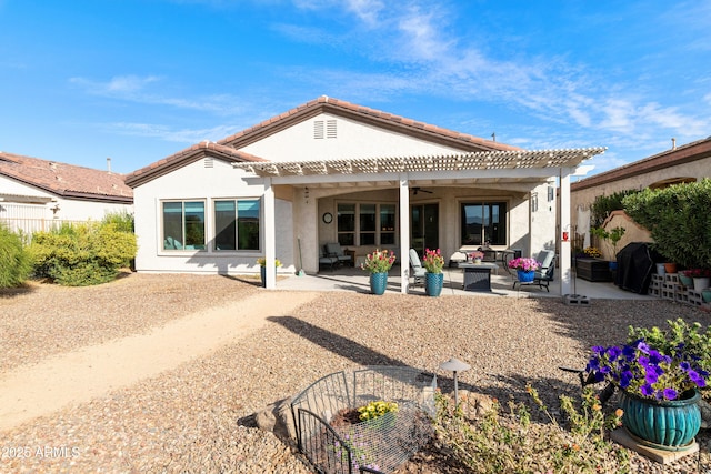 back of house featuring a pergola, outdoor lounge area, a patio, and ceiling fan