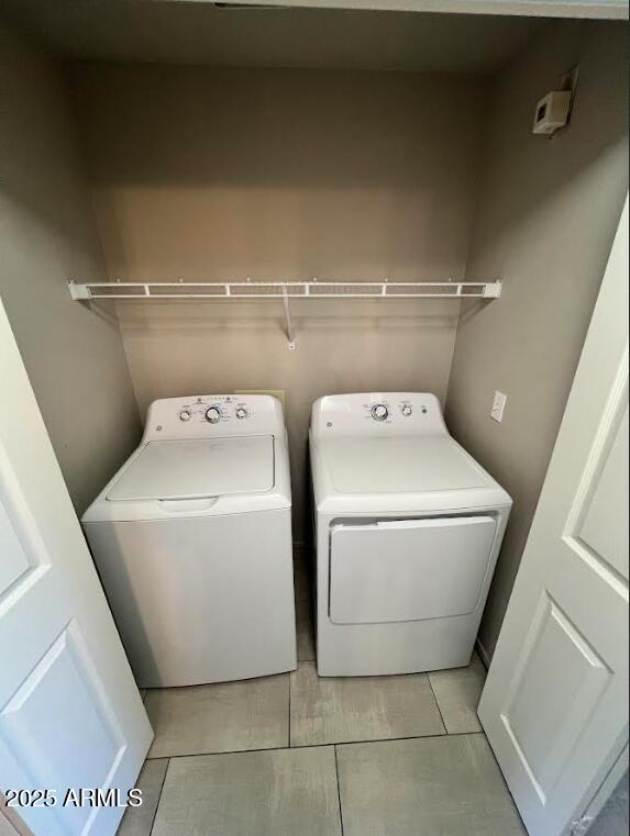 laundry room featuring laundry area and washing machine and clothes dryer