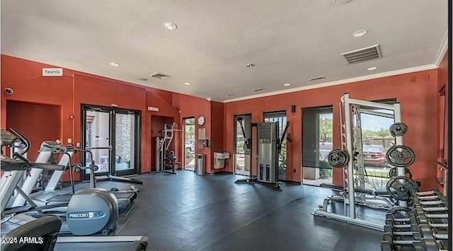 workout area featuring recessed lighting, visible vents, and crown molding