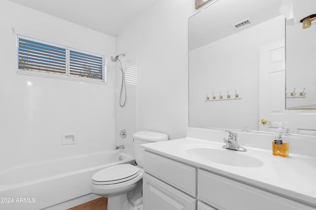 full bathroom featuring toilet, vanity, tile patterned floors, and  shower combination