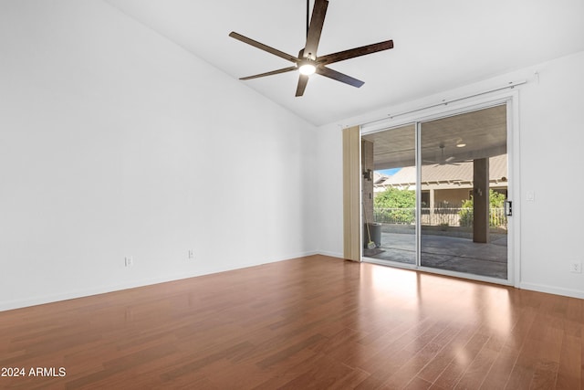 empty room with wood-type flooring, lofted ceiling, and ceiling fan