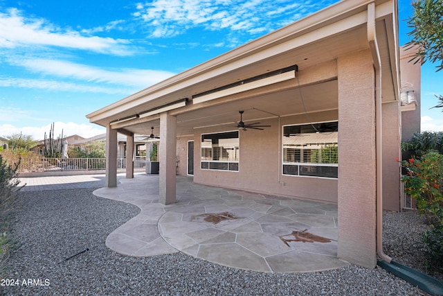 view of patio featuring ceiling fan