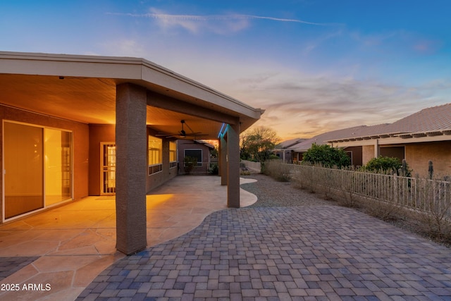 patio terrace at dusk with ceiling fan