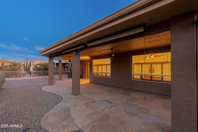 patio terrace at dusk with ceiling fan