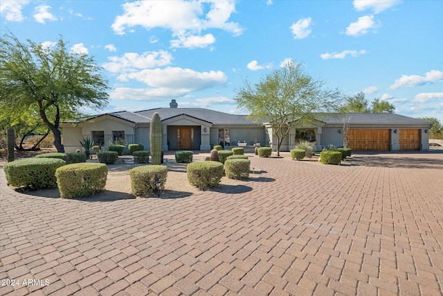 25210 N 90th Way, Scottsdale, AZ 85255 - ranch-style home featuring curved driveway and an attached garage