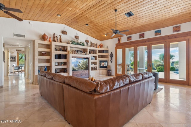 living room with ceiling fan, wooden ceiling, and high vaulted ceiling