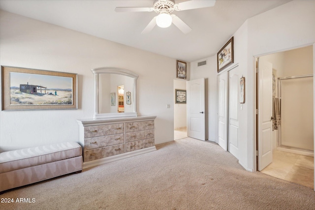 living area featuring light colored carpet and ceiling fan