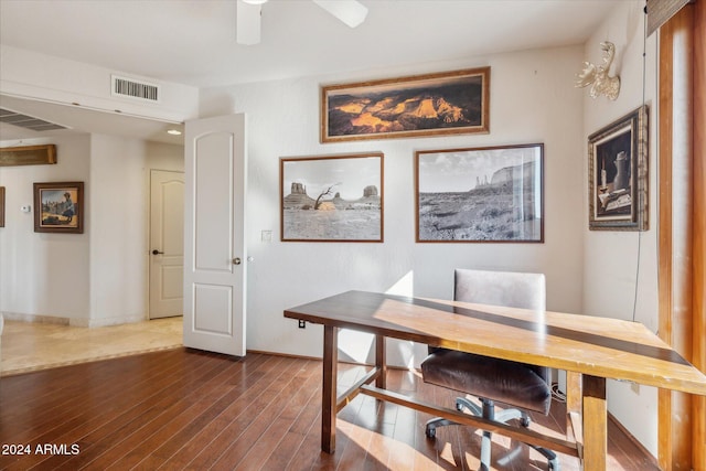 dining area with ceiling fan and dark hardwood / wood-style flooring